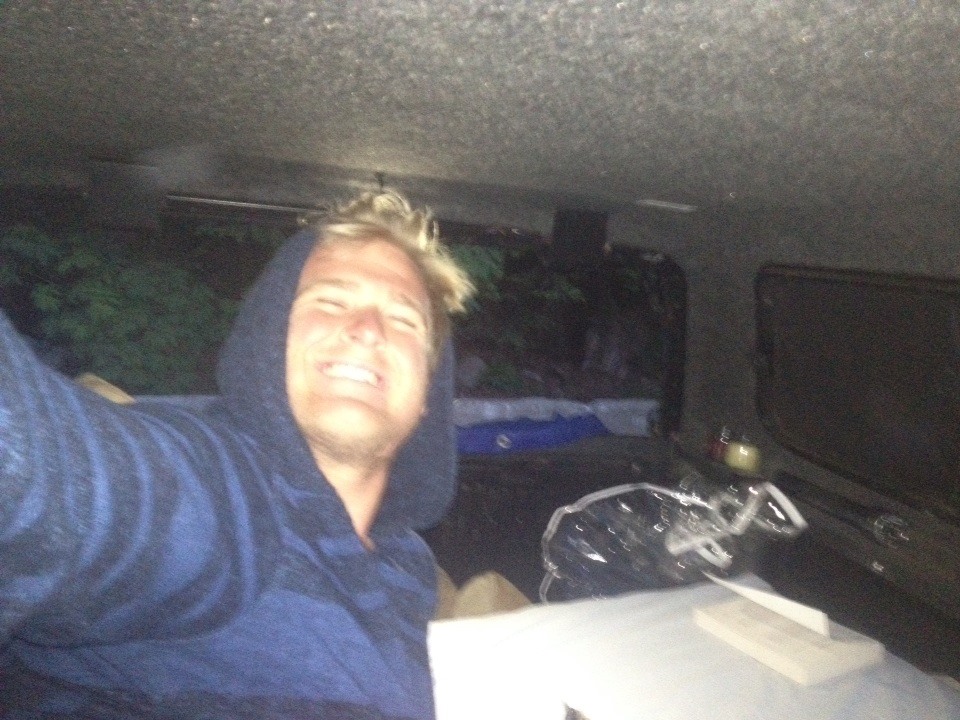 Jesse sleeping in the back of his 2003 Toyota Tundra